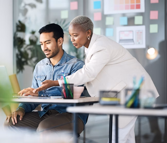 Office laptop, diversity and business people reading online report, website design feedback or research project. Collaboration, staff mentor and team designer working on company homepage development.