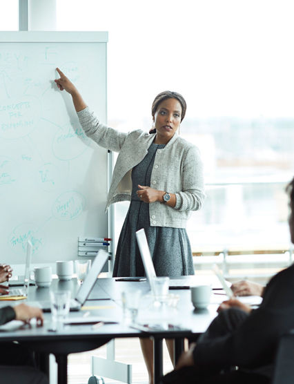 Business people in large modern meeting room
