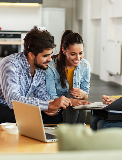 Female Real Estate agent offer home ownership and life insurance to young couple.