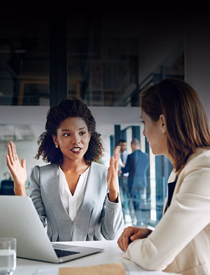 Two businesswomen talking