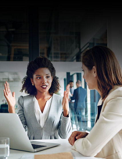 Two businesswomen talking