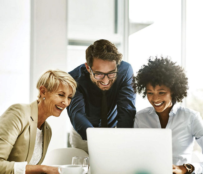 people smiling at computer