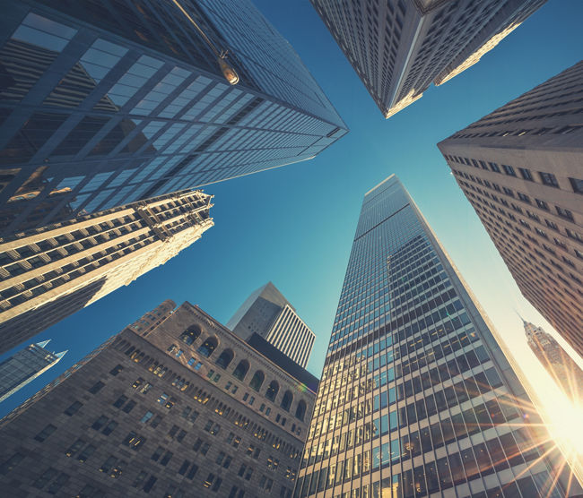 Office building top view background in retro style colors. Manhattan buildings of New York City center - Wall street