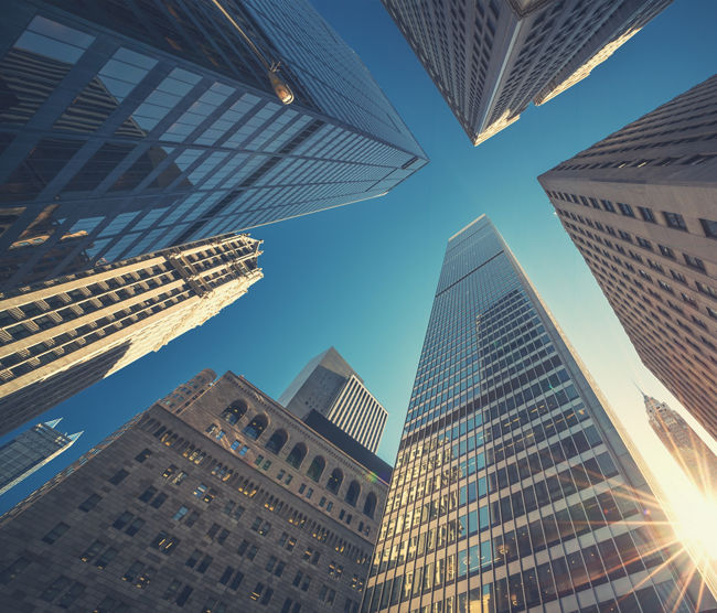 Office building top view background in retro style colors. Manhattan buildings of New York City center - Wall street