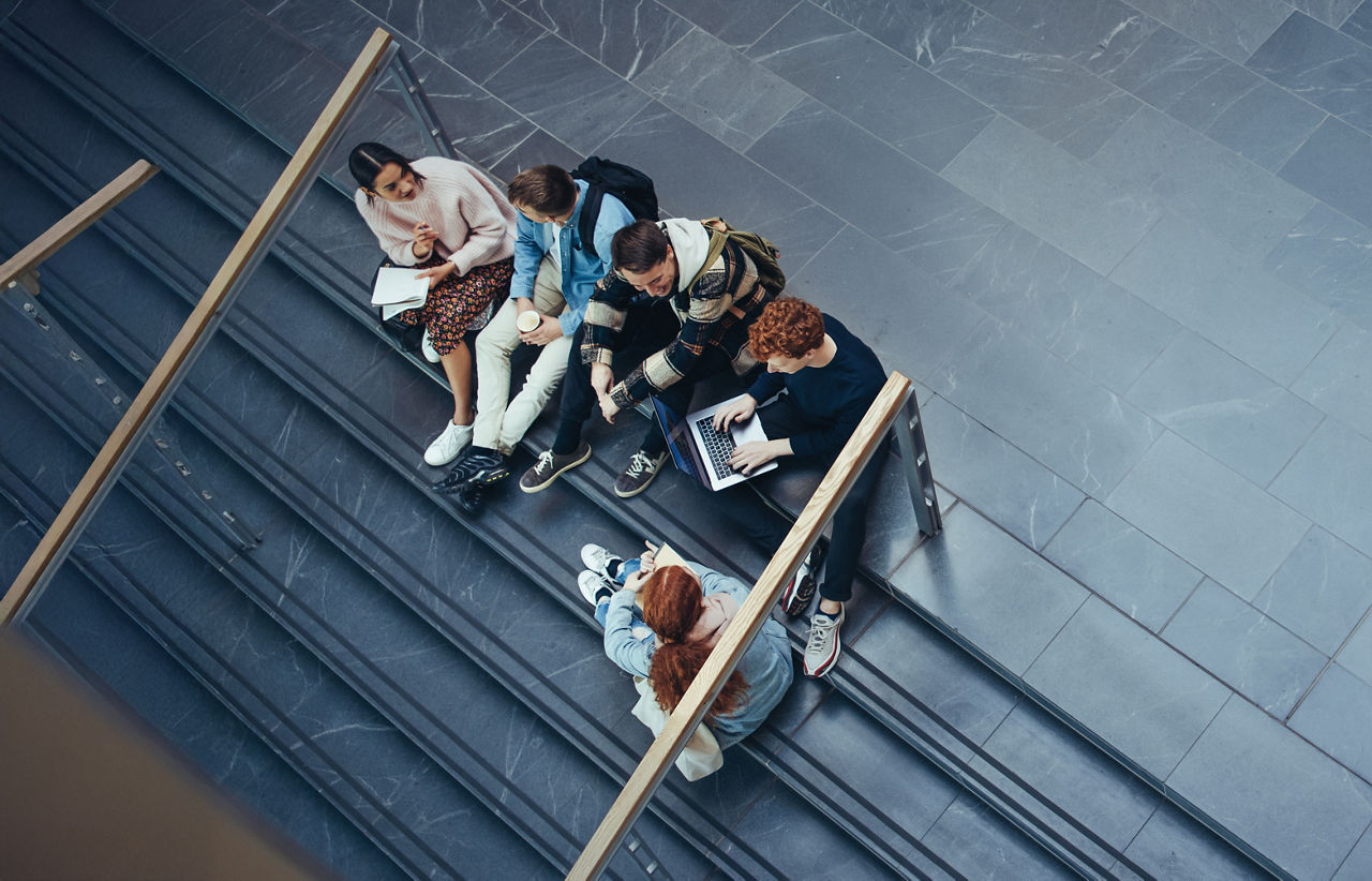 Young people studying in college campus