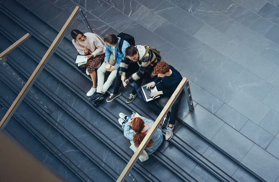 Young people studying in college campus