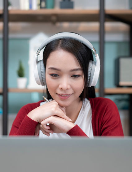 close-up shot of an attractive young businesswoman working with video conference at home