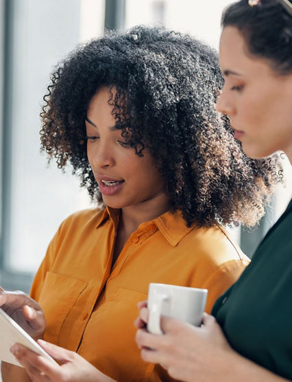 Two women looking over inventory