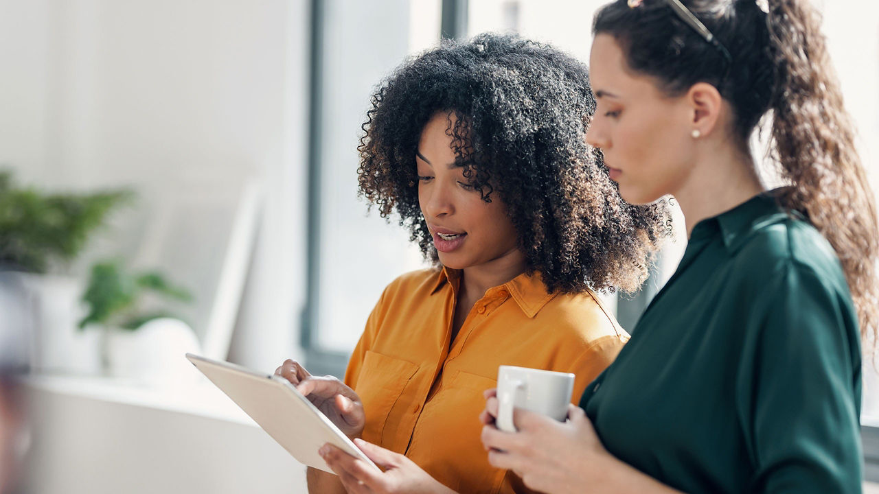 two women looking at a graph