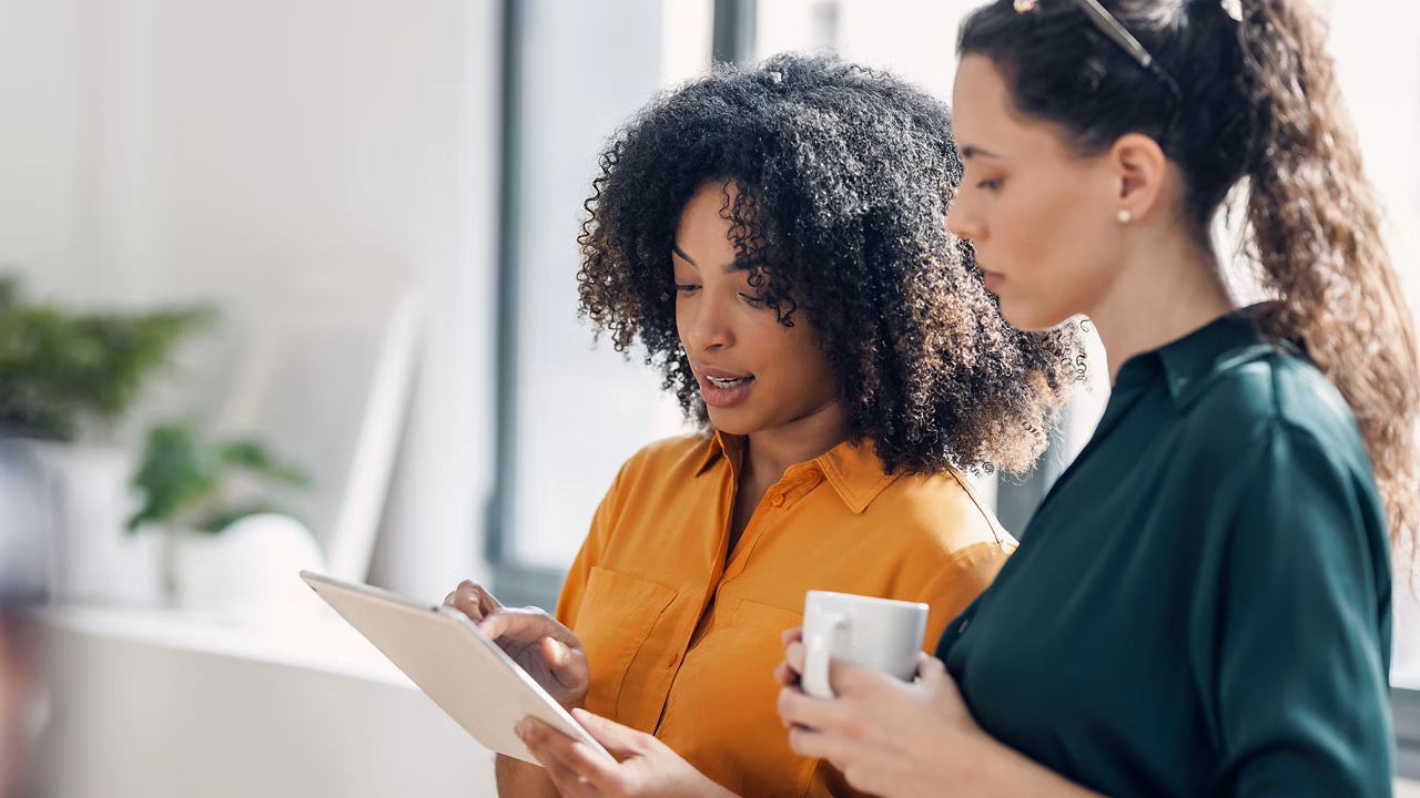 two women looking at a graph