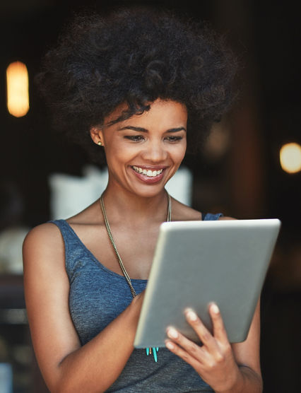 Her online orders are growing. a young woman using a digital tablet in a cafe