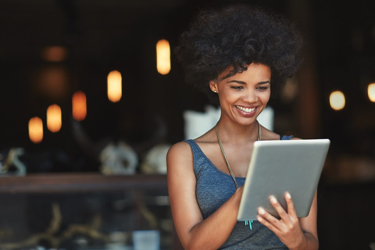 Her online orders are growing. a young woman using a digital tablet in a cafe
