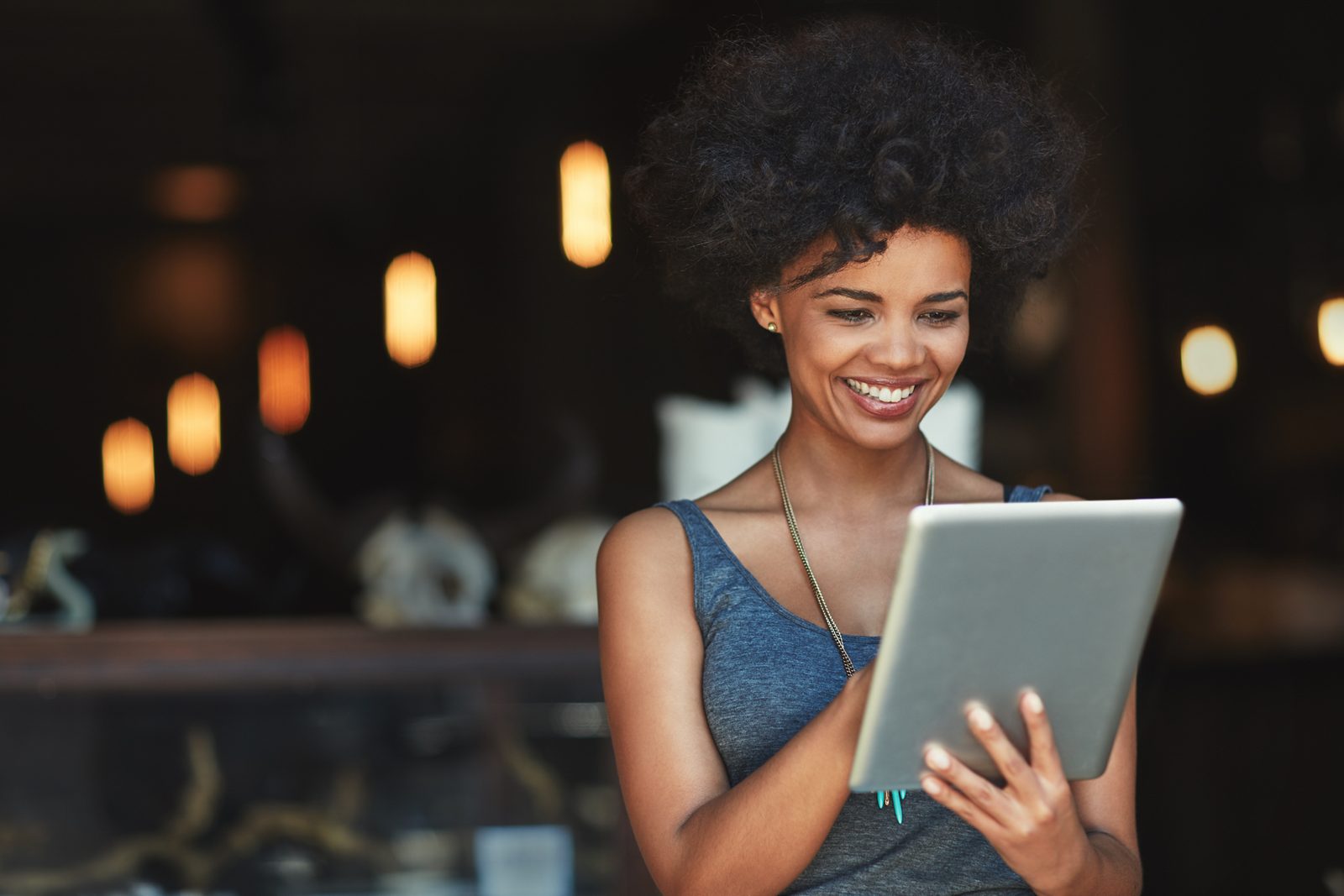 Her online orders are growing. a young woman using a digital tablet in a cafe