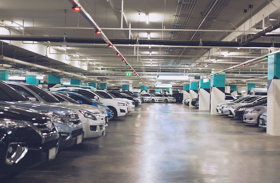 Concept sheet label write text.Cars parked in the parking lot.Open space area indoors.