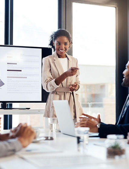 Shot of a young businesswoman delivering a presentation to her colleagues in the boardroom of a modern office