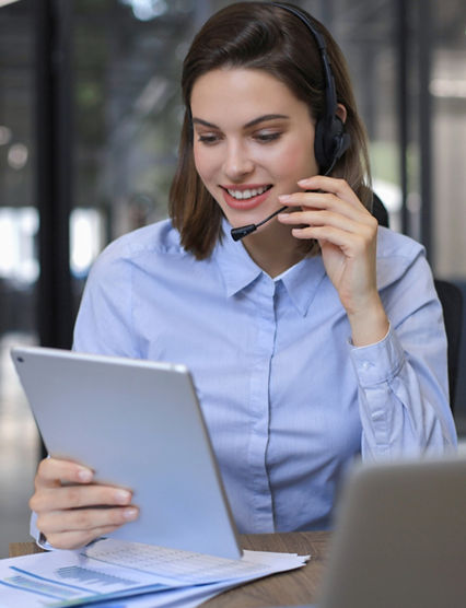 Freelance operator talking with headsets and consulting clients from office