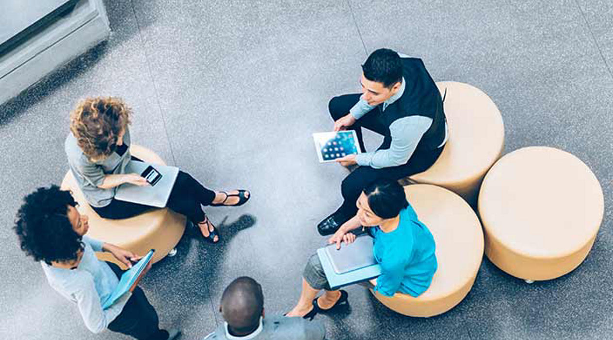 group looking at tablets in a circle