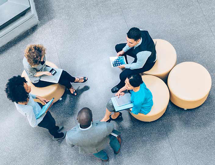 group looking at tablets in a circle