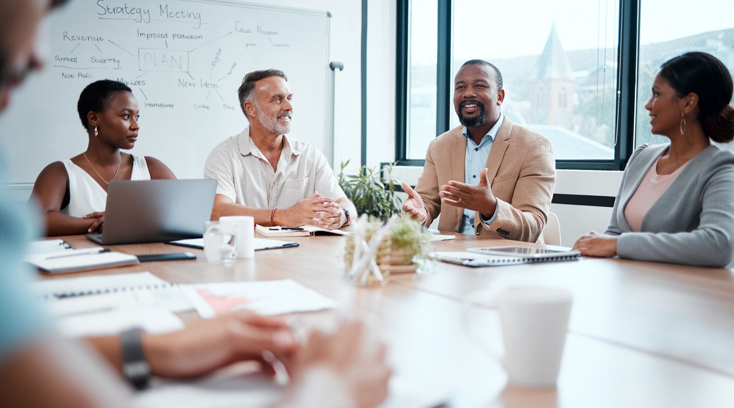 Happy business people, meeting and strategy in planning, team discussion or sharing idea at office. Group of employees in teamwork, collaboration or discussing project plan in conference at workplace.