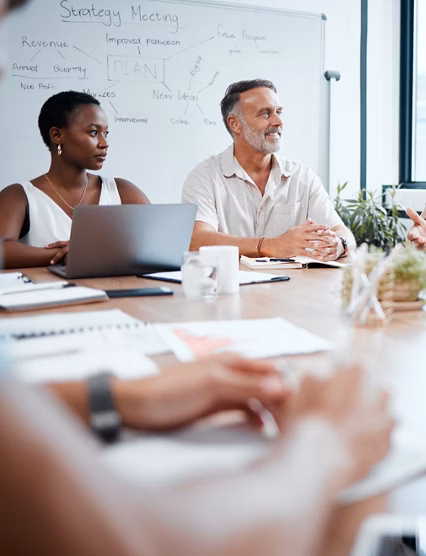 Happy business people, meeting and strategy in planning, team discussion or sharing idea at office. Group of employees in teamwork, collaboration or discussing project plan in conference at workplace.