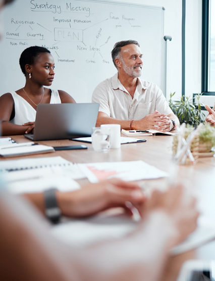 Happy business people, meeting and strategy in planning, team discussion or sharing idea at office. Group of employees in teamwork, collaboration or discussing project plan in conference at workplace.