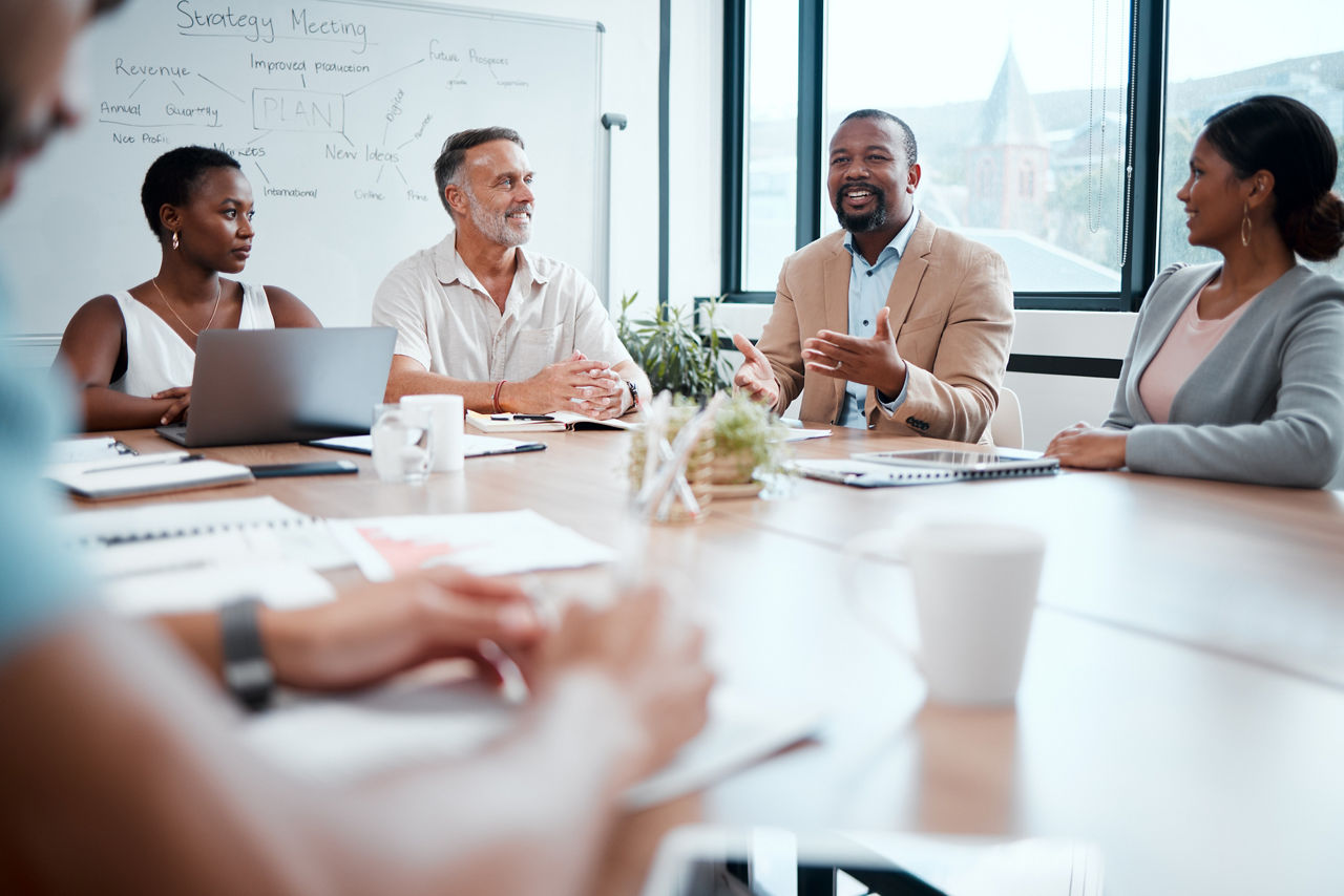 Happy business people, meeting and strategy in planning, team discussion or sharing idea at office. Group of employees in teamwork, collaboration or discussing project plan in conference at workplace.