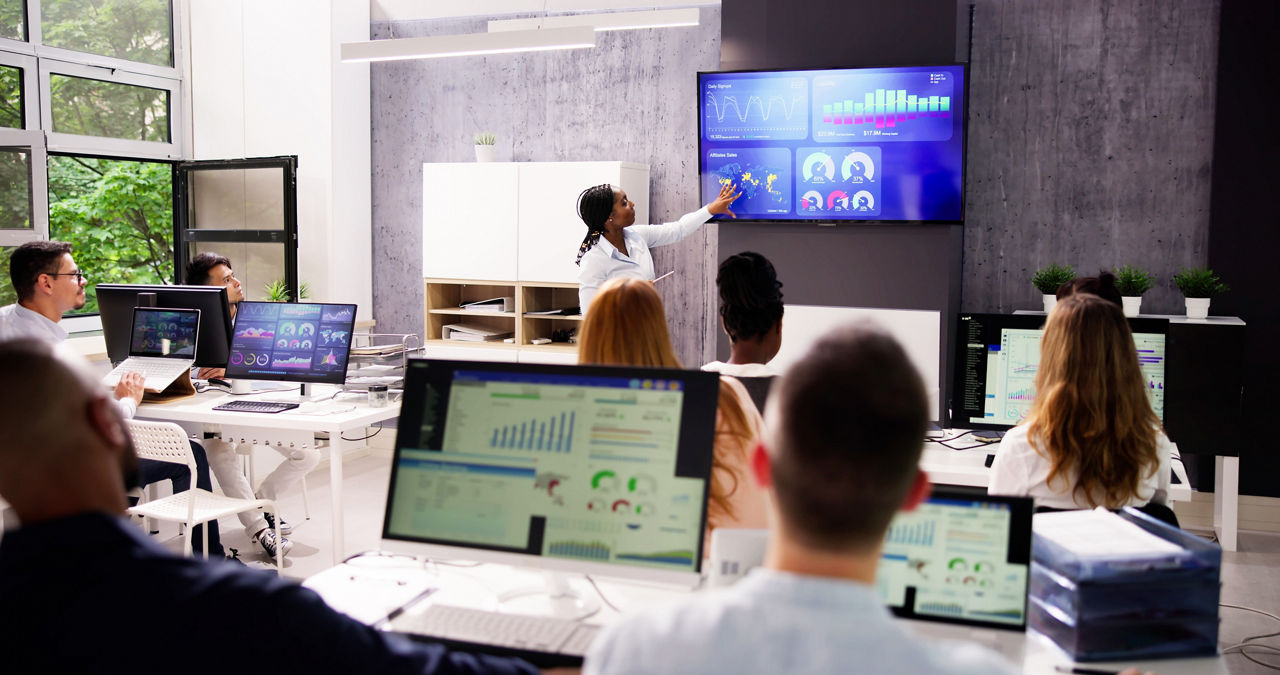 Business Presentation On TV In Corporate Training Room. Team Training