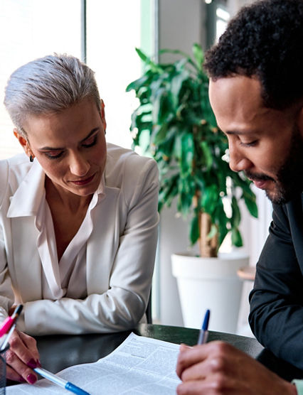 Lawyer reading a document during a meeting with a customer