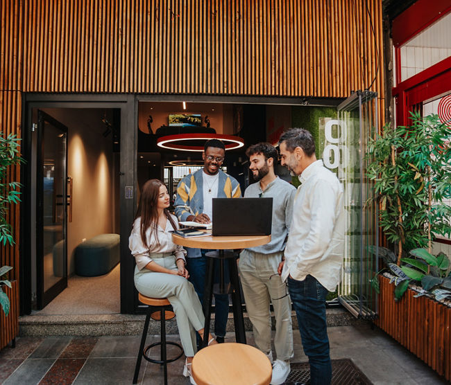 Multiracial team collaborate in a modern office, sharing innovative ideas for their company's growth and development. Creative problem-solving and teamwork lead to profitable strategies.