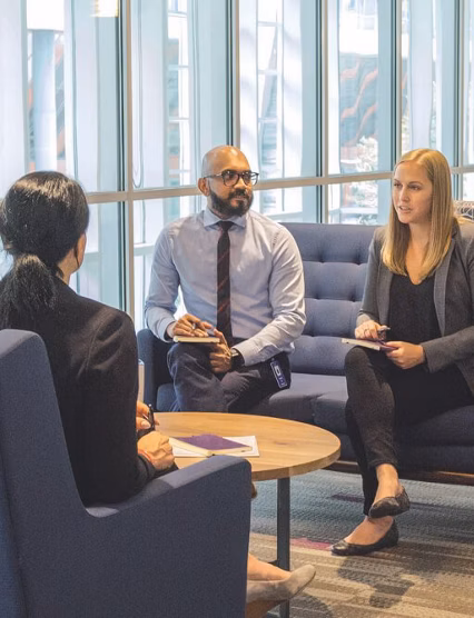 employees chatting in an office lobby