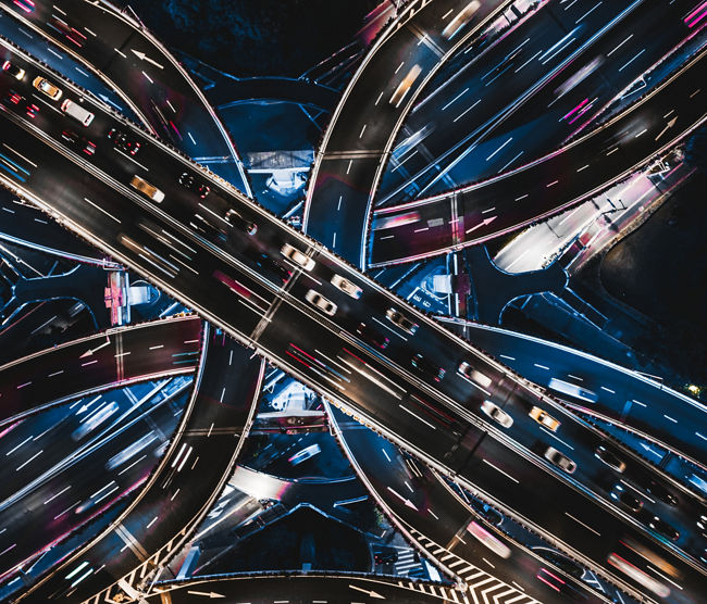 Aerial View of Overpass and City Traffic at Night / Shanghai, China