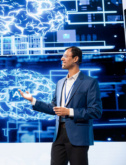 Cheerful presenter speaking at tech conference, exploring latest AI technology trends and case studies. Upbeat IT professional presenting how artificial intelligence is shaping future during event