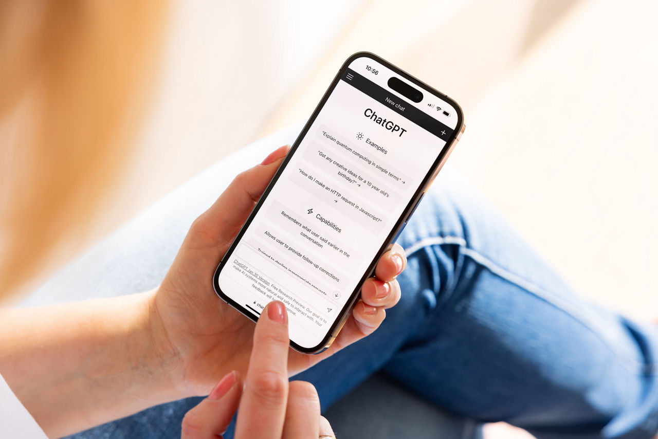 Madrid, Spain - February 13, 2023: Woman using ChatGPT, AI or artificial intelligence chatbot developed by OpenAI.