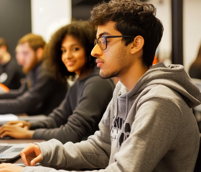 Students Engaged in Computer Programming Class Session