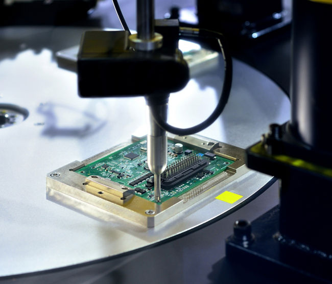 Close-up of making circuit board at production line.