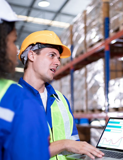 Diversity of Warehouse staff wearing a protective face mask in safety suite using apps on digital tablet checking and receiving items goods for storage in the warehouse, modern smart logistic industry