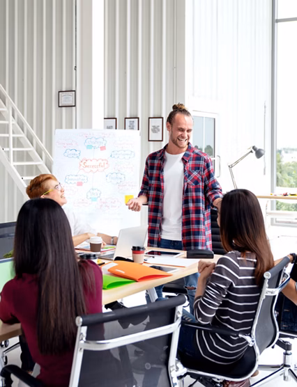 Group of young attractive asian creative design team meeting,smiling and laughing at office workshop. Asian employee engaged together with effective and productive meeting and happy workplace concept.
