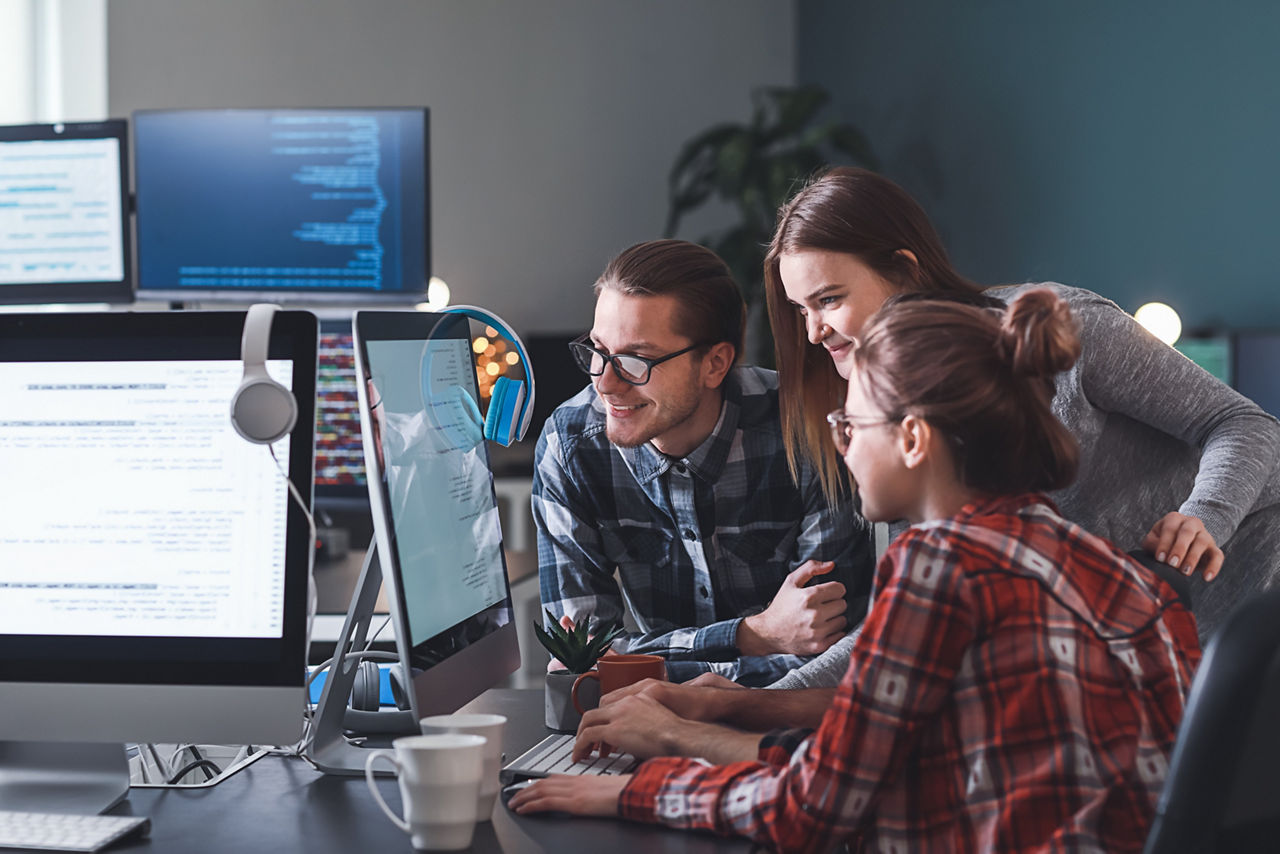 Team of programmers working in office