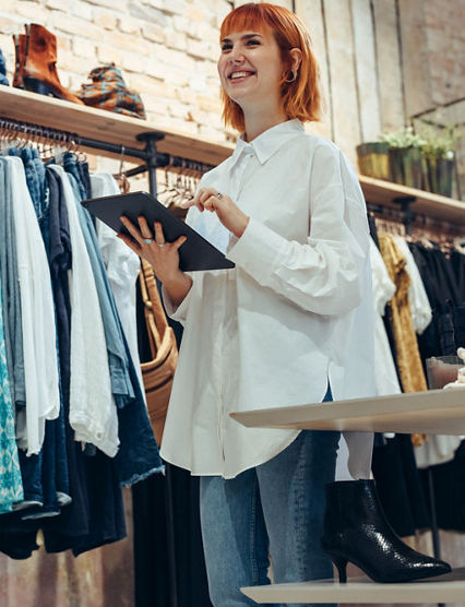 Smiling associate in clothing store