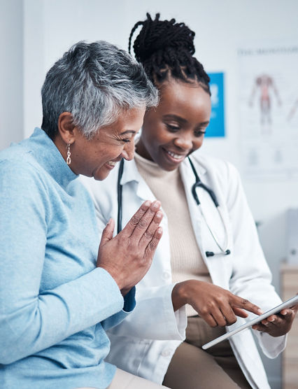 Black woman, doctor and senior patient with tablet, results and happy for health clearance, advice or report. African medic, mobile touchscreen and healthcare with smile, tech and support in hospital.