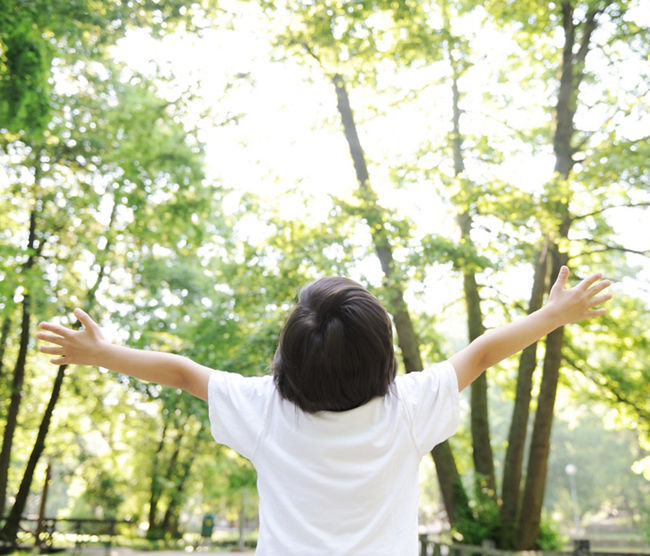 Freedom, kid on meadow, open arms