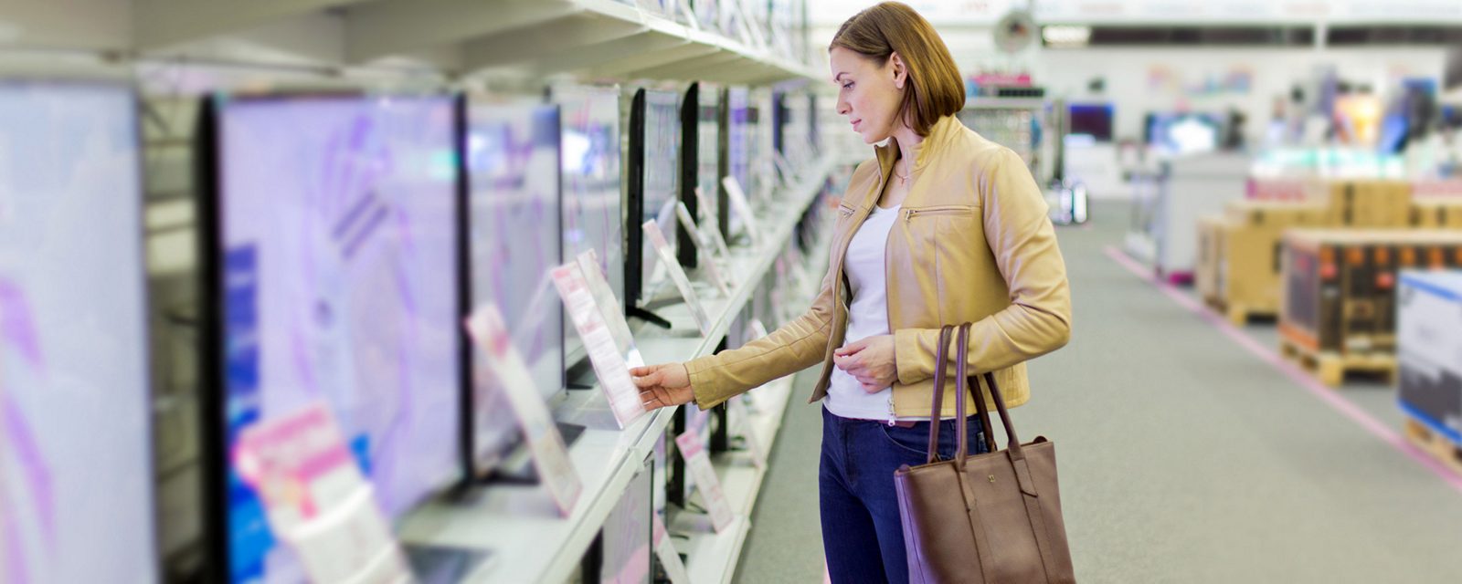 woman looking at electronics.
