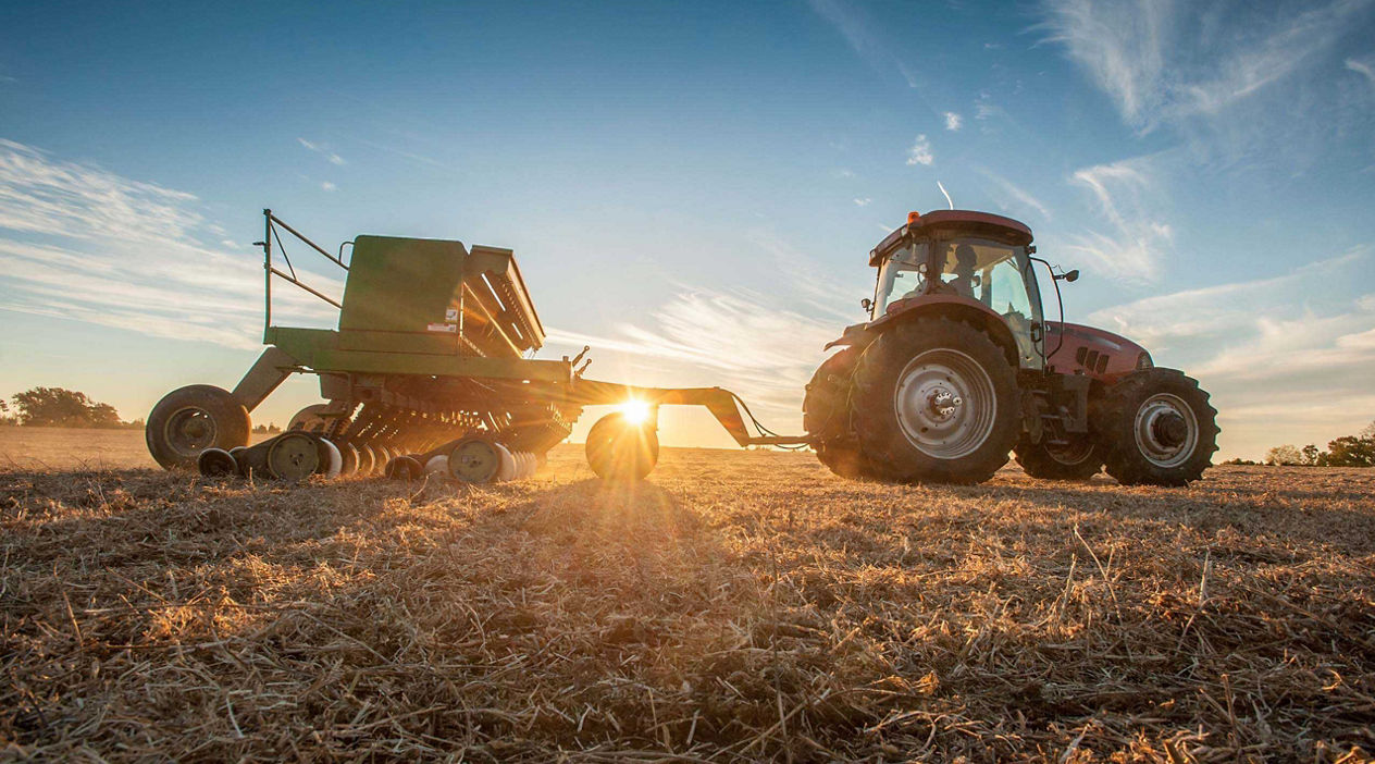 tractor with a  sunset background