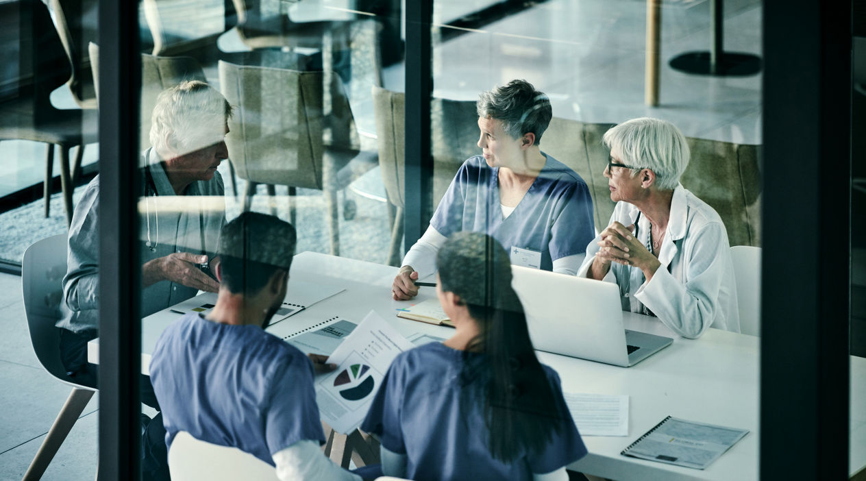 Shot of a group of medical professionals having a meeting together inside a boardroom at a hospital