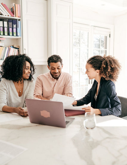 Couple speaking to their accountant.