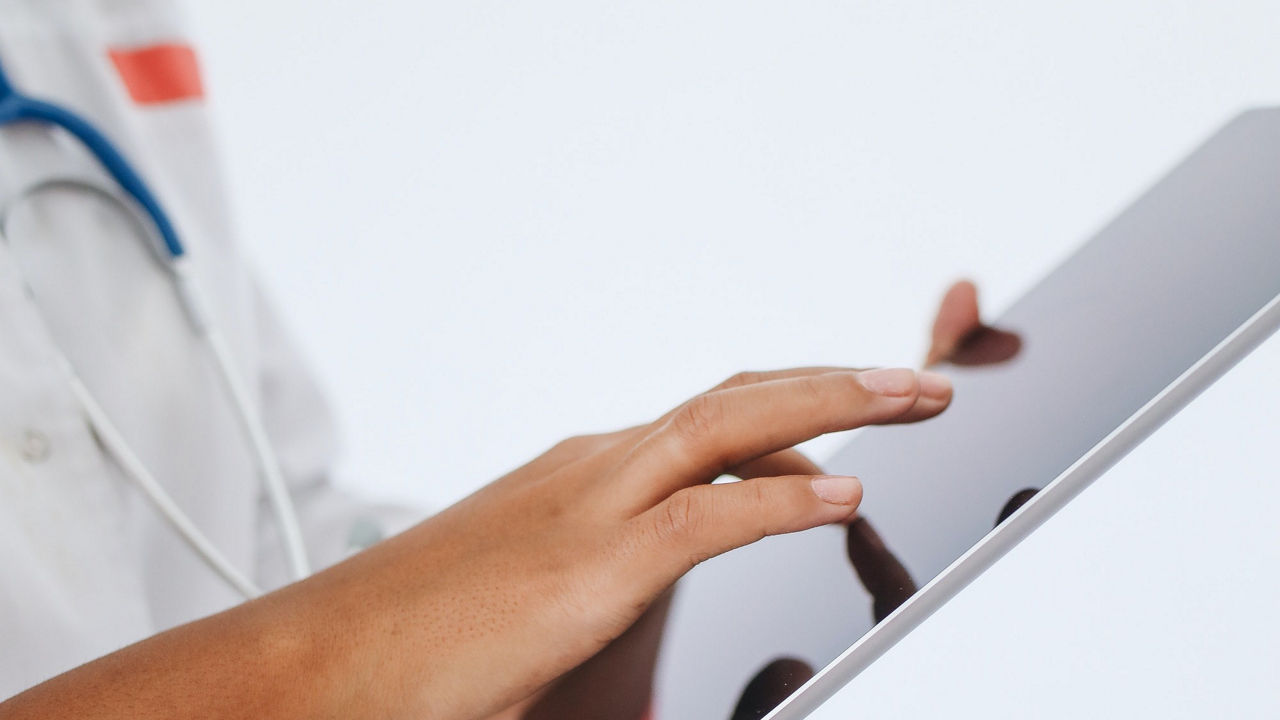 Healthcare working on tablet device