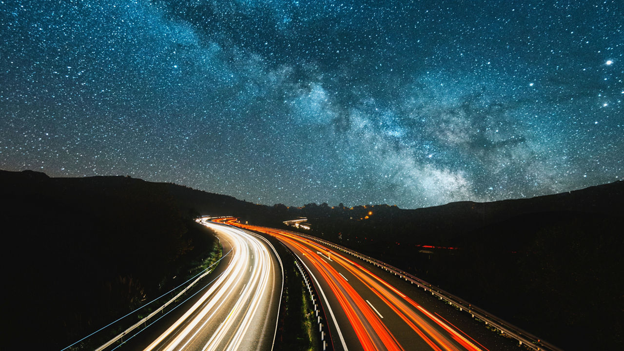 Blurred car headlights moving on a highway