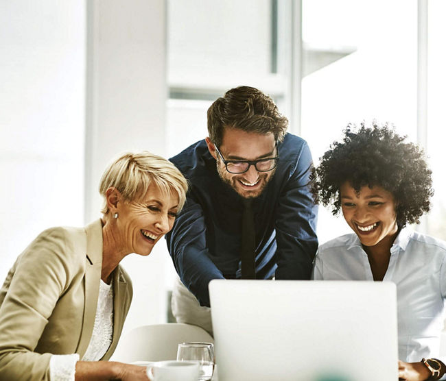 people smiling at computer