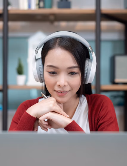 close-up shot of an attractive young businesswoman working with video conference at home