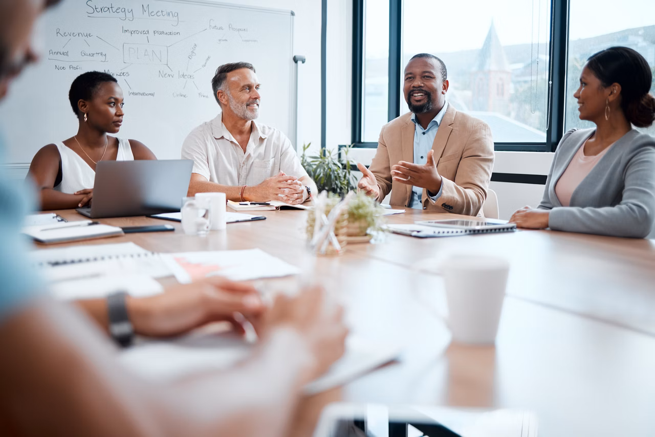 Happy business people, meeting and strategy in planning, team discussion or sharing idea at office. Group of employees in teamwork, collaboration or discussing project plan in conference at workplace.